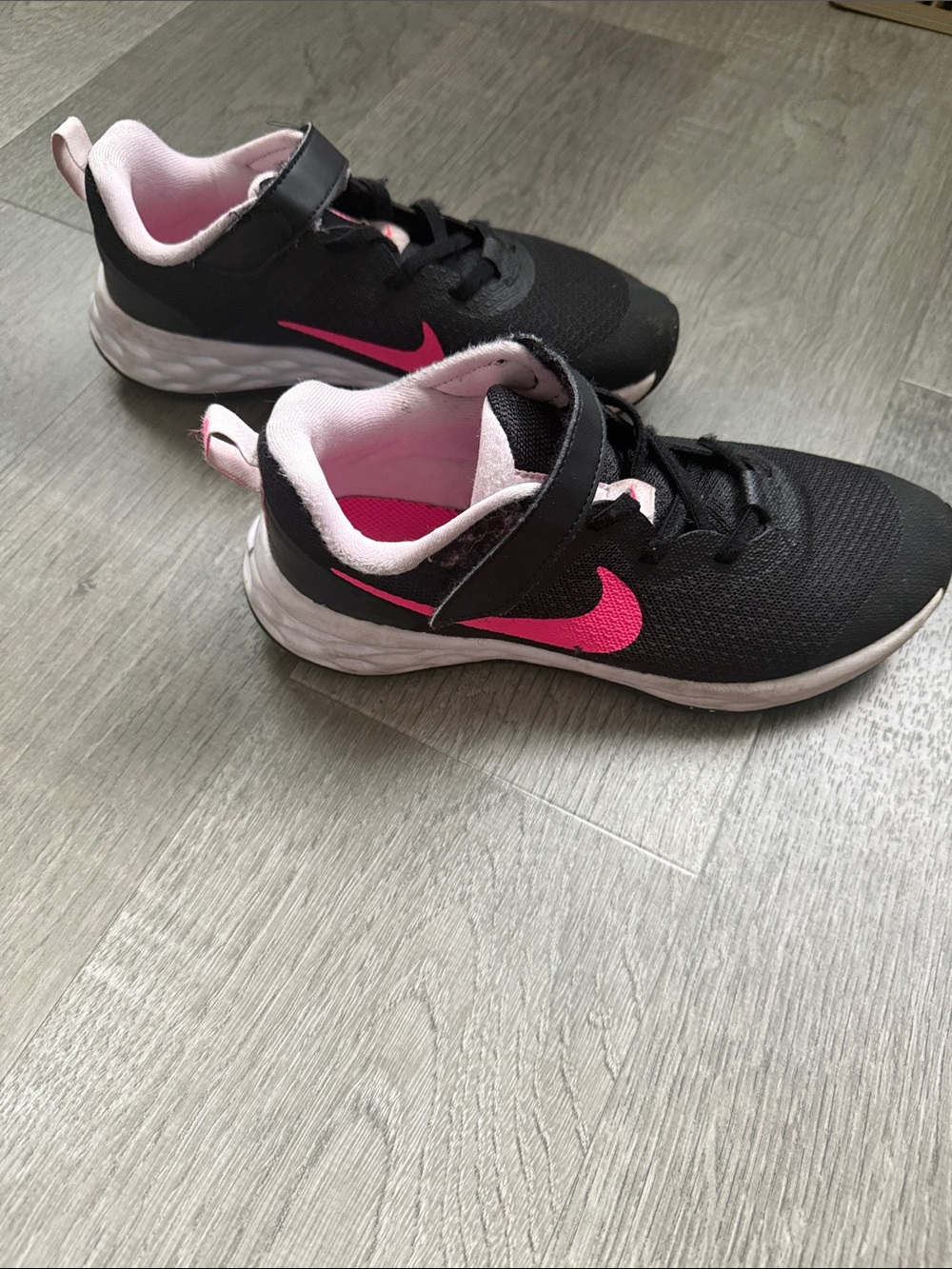 Nike Black Athletic Sneakers with Pink Swoosh